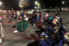 FLIPPER kids enjoying an outdoor movie at a safe distance!