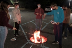 FLIPPER  group enjoying some S’mores before the outdoor movie night